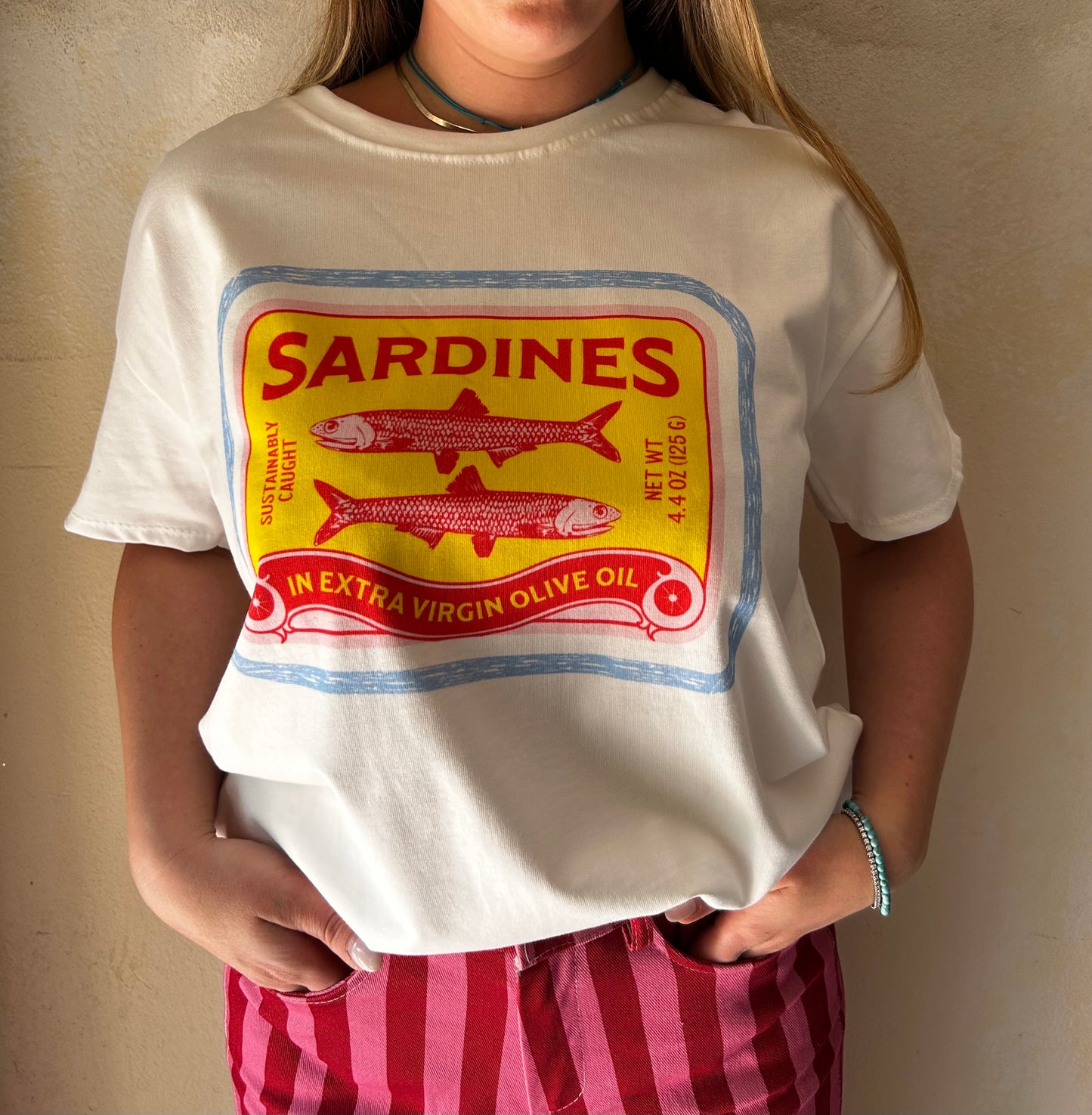 T-shirt over sardines